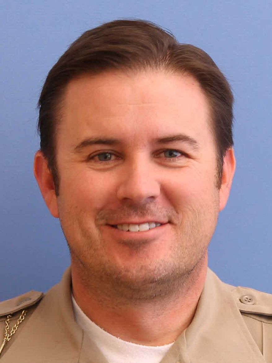 In this undated photo provided by the Utah County Sheriff's Office shows Sgt. Cory Wride. Officials say Utah County sheriff's Sgt. Cory Wride had stopped to check on a truck that appeared to be disabled on a two-lane highway Thursday, Jan. 30, 2014. He was using his computer to do a background check when he was shot from the truck and killed. (AP Photo/Utah County Sheriff's Office)