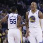 Golden State Warriors&#39; Marreese Speights (5) celebrates after teammate Jordan Crawford (55) made a 3-point basket against the Los Angeles Clippers during the first half of an NBA basketball game Thursday, Jan. 30, 2014, in Oakland, Calif. (AP Photo)