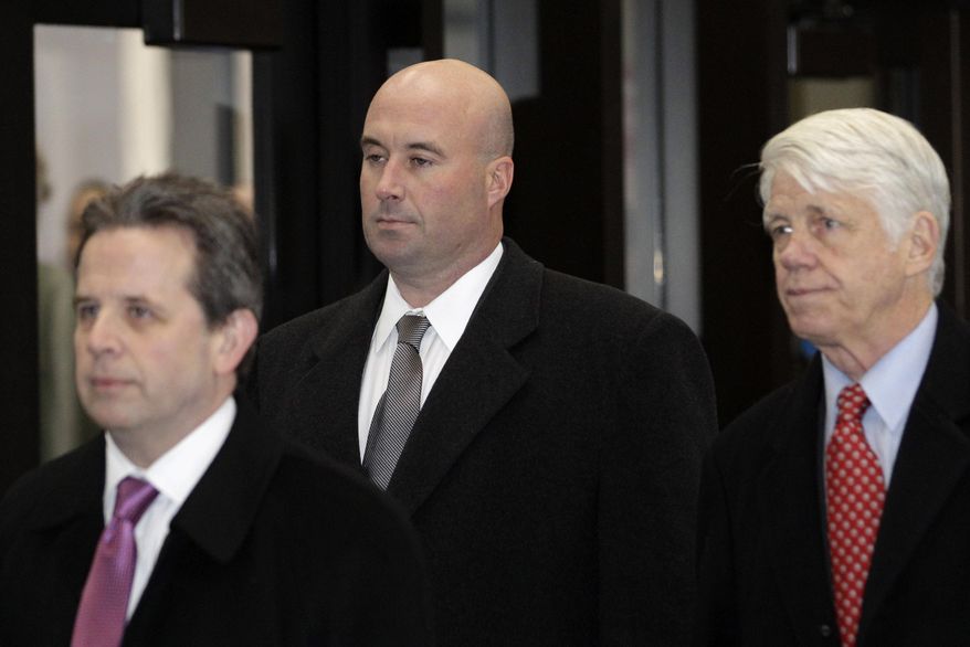 FILE - In this Dec. 10, 2012 file photo, Richard Vanecko, nephew of former Chicago Mayor Richard Daley, center, accompanied by attorneys Mark Martin, left, and Tom Breen, arrives at the Leighton Criminal Courts Building in Chicago for his arraignment on involuntary manslaughter charges. On Friday, Jan. 31, 2014, at a Rolling Meadows, Ill., courthouse, Vanecko pleaded guilty to involuntary manslaughter as part of a deal with a special prosecutor in the death of a man he got into a fight with outside a bar in 2004. (AP Photo/M. Spencer Green, File)