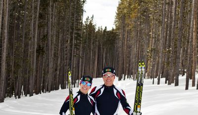 In this photo taken on Monday, Jan. 27, 2014, cross-country skiers Gary and Angelica di Silvestri pose for a photo at the Yellowstone Club in Big Sky, Mont. The American-born man and his Italian-born wife will be representing the tiny Caribbean island nation of Dominica at the Winter Olympics in Sochi next month. The former finance professionals, granted Dominica citizenship for their philanthropic work on the island, are finishing their training in Montana while hastily arranging their own visas, travel logistics and footing the bill for the entire expedition. (AP Photo/Janie Osborne)