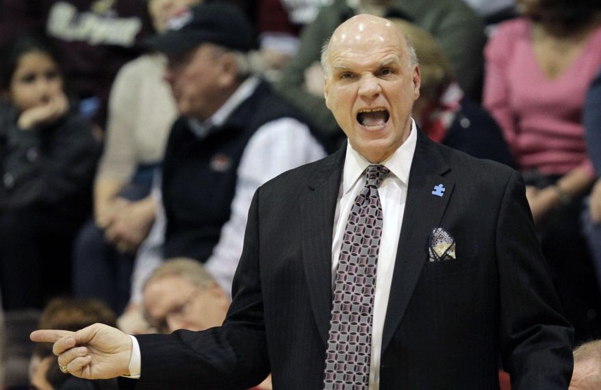 St Josephs' coach Phil Martelli shouts from the sideline in the first half of an NCAA college basketball game with Massachusetts, Saturday, Feb. 1, 2014, in Philadelphia. (AP Photo/Laurence Kesterson)