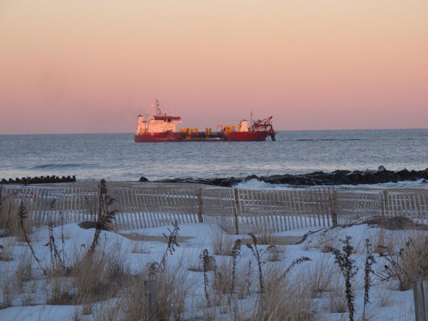 In this Jan. 30, 2014 photo, a dredge ship works off the coast of Asbury Park, N.J., part of beach replenishment work going on along much of new jersey's coastline in the aftermath of Superstorm Sandy. (AP Photo/Wayne Parry)