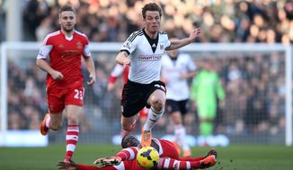 Fulham&#x27;s Scott Parker, center, and Southampton&#x27;s Victor Wanyama, below, battle for possession of the ball during their English Premier League soccer match at Craven Cottage, London, Saturday, Feb. 1, 2014. (AP Photo/John Walton, PA Wire)   UNITED KINGDOM OUT  -  NO SALES  -  NO ARCHIVES