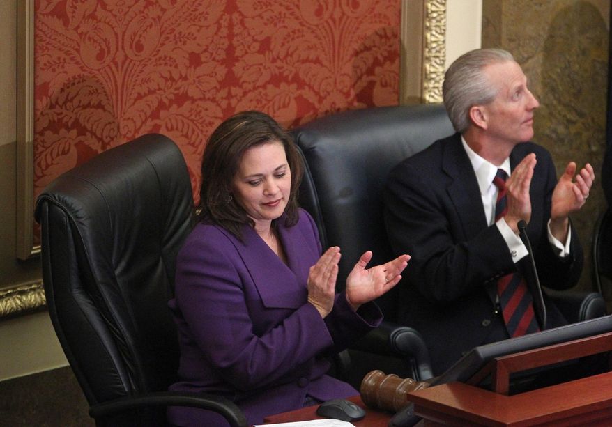 Speaker of the Utah House of Representatives, Becky Lockhart, R-Provo, and Senate President Wayne Niederhauser, R-Sandy, clap during Utah Gov. Gary Herbert fifth annual State of the State address Wednesday, Jan. 29, 2014, in Salt Lake City. Herbert detailed his priorities for 2014 after making air quality and education high-profile issues in his proposed $13.3 billion budget.  (AP Photo/Rick Bowmer)