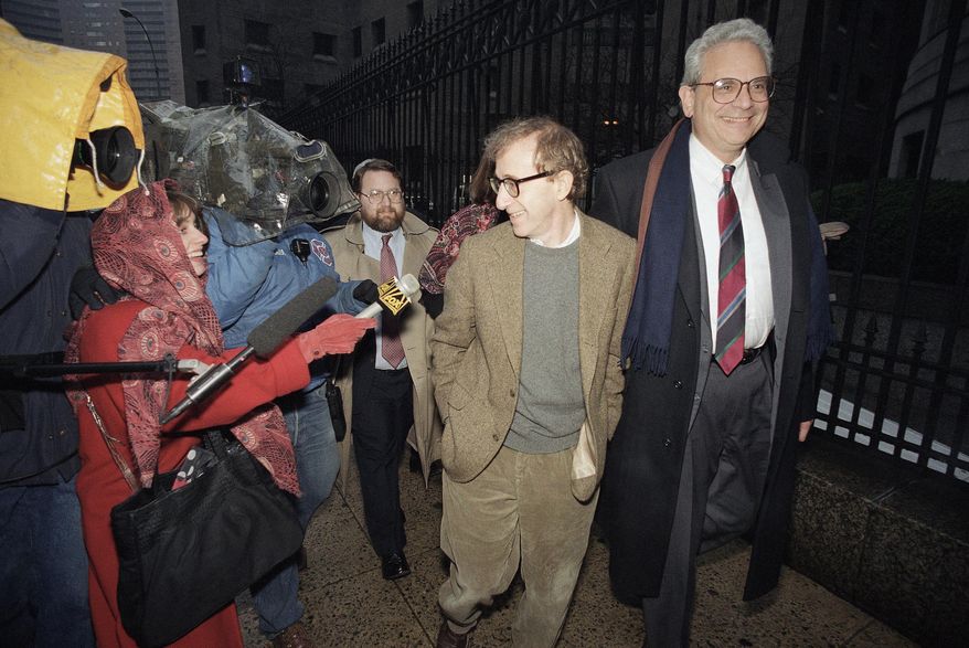 ** FILE ** This Jan. 12, 1993, file photo shows director Woody Allen trading grins with a pursuing television reporter as he arrives at State Supreme Court in Manhattan, New York, for a hearing in which he requested more liberal visitation rights with his children during his ongoing dispute with ex-lover actress Mia Farrow. Dylan Farrow renewed molestation allegations against Allen, Saturday, Feb. 1, 2014, claiming the movie director sexually assaulted her when she was 7 after he and actress Mia Farrow adopted her. (AP Photo/Mario Cabrera, File)