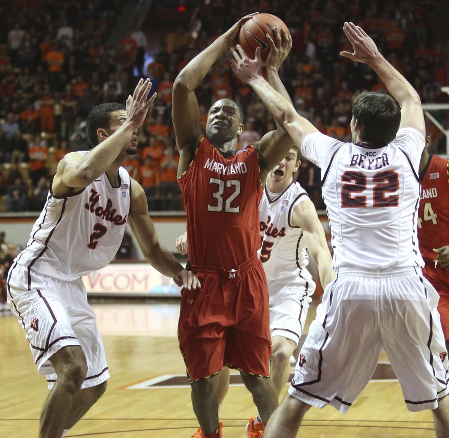 Maryland's Dez Wells (32) drives through the defense of Virginia Tech's Joey van Zegeren (2) Will Johnston ( 25) and Christian Beyer (22) during the first half of an NCAA college basketball game in Blacksburg, Va., Saturday, Feb. 1 2014. (AP Photo/The Roanoke Times, Matt Gentry) LOCAL TV OUT; SALEM TIMES REGISTER OUT; FINCASTLE HERALD OUT; CHRISTIANBURG NEWS MESSENGER OUT; RADFORD NEWS JOURNAL OUT; ROANOKE STAR SENTINEL OUT