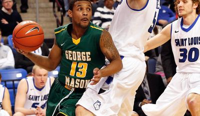 George Mason's Corey Edwards (13) works the baseline as Saint Louis' Rob Loe (51) defends during the first half of an NCAA college basketball game Saturday, Feb. 1, 2014, in St. Louis. (AP Photo/Scott Kane)