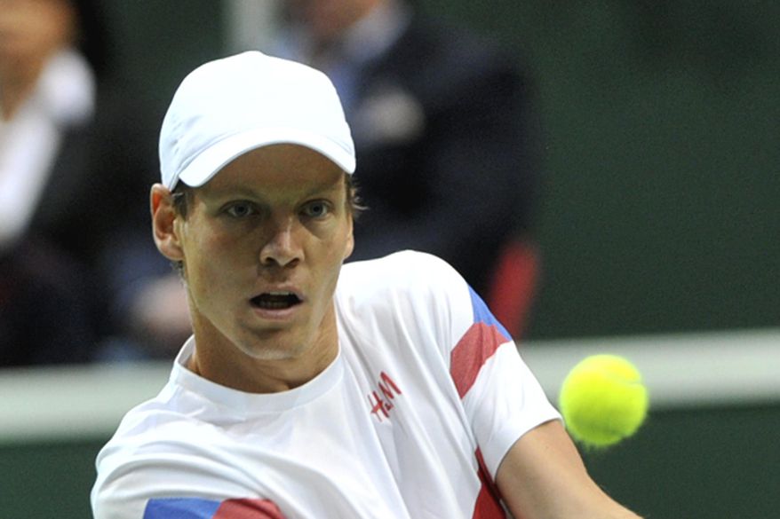 Tomas Berdych from the Czech Republic returns to Thiemo De Bakker from the Netherlands during their Davis Cup first round singles match in Ostrava, Czech Republic, Sunday, Feb. 2, 2014.  Berdych won  6-1, 6-4, 6-3. (AP Photo,CTK/Jaroslav Ozana) SLOVAKIA OUT
