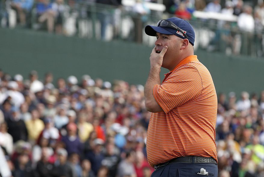 Kevin Stadler watches Bubba Watson miss a putt on the 18th hole, making Stadler the winner during the final round of the Phoenix Open golf tournament on Sunday, Feb. 2, 2014, in Scottsdale, Ariz. (AP Photo/Ross D. Franklin)