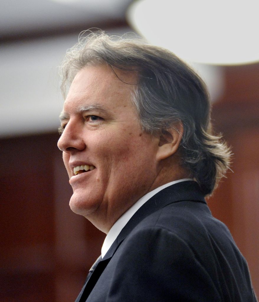 FILE - In this March 19, 2013 file photo, Michael David Dunn smiles at family and friends who came to testify at his bond hearing in Jacksonville, Fla. Dunn is about to go on trial for the alleged murder of a black teenager in a case that raises comparisons to the George Zimmerman-Trayvon Martin case. Jury selection is scheduled to begin Monday, Feb. 4, 2013, in Jaacksonville, Fla. He fatally shot 17-year-old Jordan Davis in November 2012 outside a convenience store following an argument over loud music Davis and his friends were playing from their SUV. (AP Photo/The Florida Times-Union, Will Dickey, File)