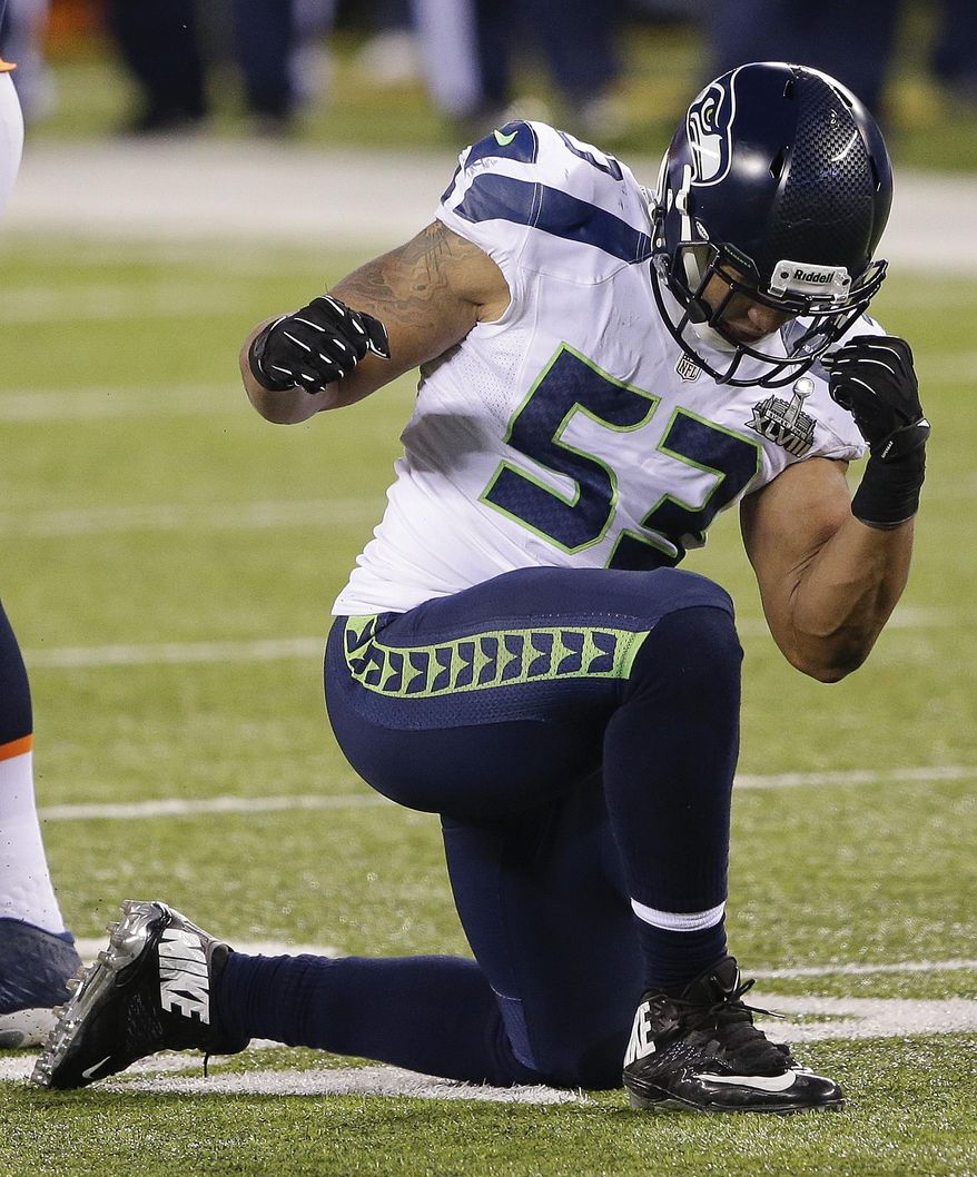 Seattle Seahawks outside linebacker Malcolm Smith (53) reacts after making a tackle against the Denver Broncos during the second half of the NFL Super Bowl XLVIII football game, Sunday, Feb. 2, 2014, in East Rutherford, N.J. (AP Photo/Gregory Bull)