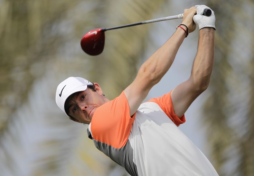 Rory McIlroy of Northern Ireland plays a shot off the 3rd tee during the final round of the Dubai Desert Classic golf tournament in Dubai, United Arab Emirates, Sunday Feb. 2, 2014. (AP Photo/Kamran Jebreili)