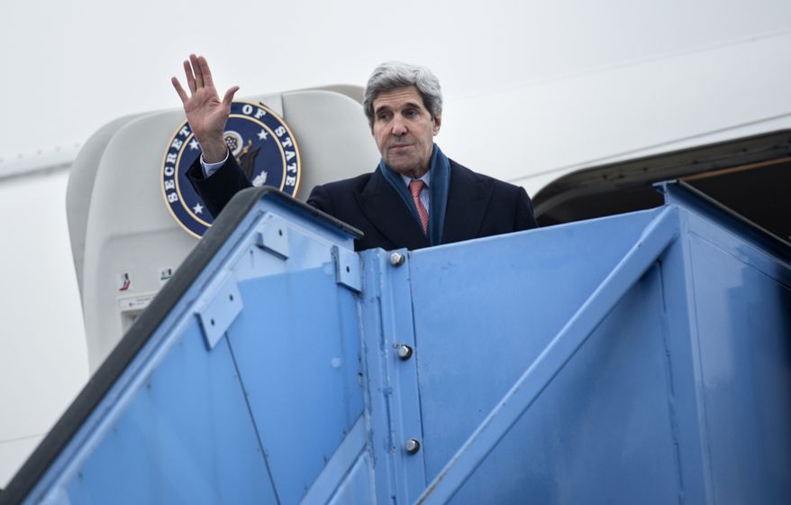 U.S. Secretary of State John Kerry waves while boarding his plane at Franz-Josef-Strauss Airport in Munich, southern Germany, on Sunday Feb. 2, 2014. Kerry was in the Bavarian capital to attend the Munich Security Conference. (AP Photo/Brendan Smialowski,Pool)I