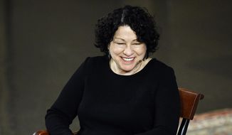 US Supreme Court Justice Sonia Sotomayor smiles as she speaks at Yale University, Monday, Feb. 3, 2014, in New Haven, Conn. Sotomayor, who grew up poor in the Bronx, described how she navigated new worlds making into Ivy League universities and then onto the nation’s highest court.  (AP Photo/Jessica Hill)
