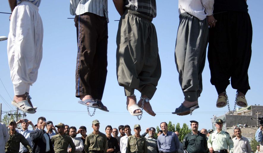 Extreme punishment: Public hangings of convicted criminals in Iran have risen to more than 66 per month since Hassan Rouhani, portrayed as a moderate reformer, became president in August. Rights advocates say international law is being violated. (Associated Press)