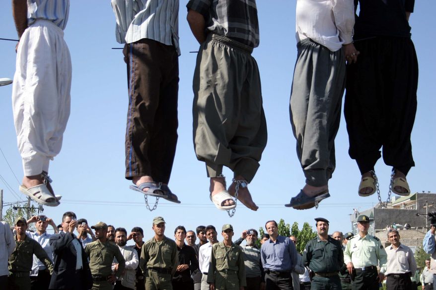 Extreme punishment: Public hangings of convicted criminals in Iran have risen to more than 66 per month since Hassan Rouhani, portrayed as a moderate reformer, became president in August. Rights advocates say international law is being violated. (Associated Press)
