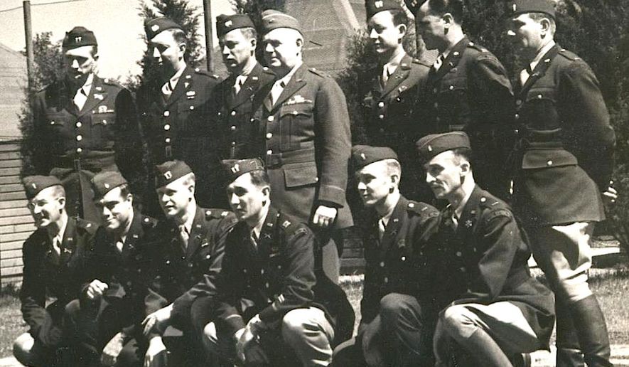 Original members of the Office of Strategic Services — the predecessor of the CIA — pose with Gen. William &quot;Wild Bill&quot; Donovan (standing fourth from left), who founded the clandestine organization in 1942. (OSS SOCIETY)