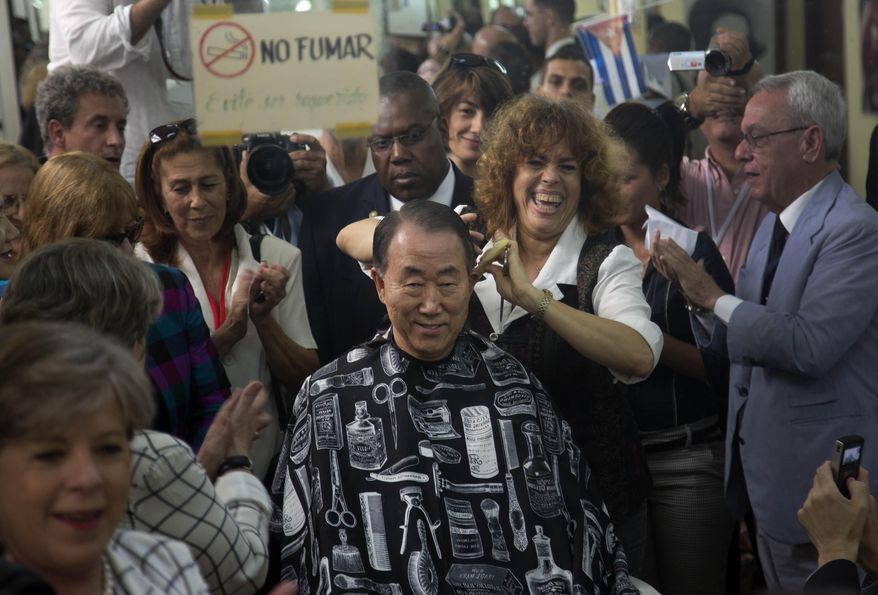 In this Monday, Jan. 27, 2014 photo, United Nations Secretary-General Ban Ki-moon, gets a haircut in a barbershop in Old Havana, Cuba. Ban Ki-moon as well as leaders from Latin America and the Caribbean are arrived in Havana to participate in the Community of Latin American and Caribbean States, or CELAC summit. (AP Photo/Ramon Espinosa)