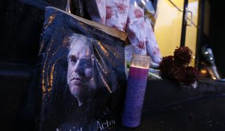 A makeshift memorial sits outside the home of actor Philip Seymour Hoffman, Monday, Feb. 3, 2014, in New York. Hoffman, 46, was found dead Sunday in his apartment of a suspected drug overdose. (AP Photo/Jason DeCrow)