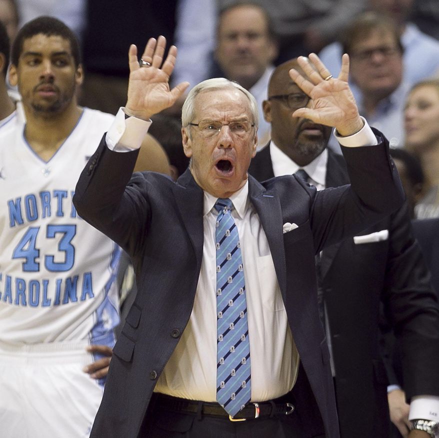 North Carolina's coach Roy Williams directs his team during the first half of an NCAA basketball game, Tuesday, Feb. 4, 2014 at the Smith Center in Chapel Hill, N.C. (AP Photo/The News & Observer, Robert Willett)