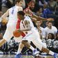 Memphis guard Joe Jackson (1) uses a pick by teammate Austin Nichols (4) to get around Rutgers forward J.J. Moore, back, in the first half of an NCAA college basketball game, Tuesday, Feb. 4, 2014, in Memphis, Tenn. (AP Photo/Lance Murphey)