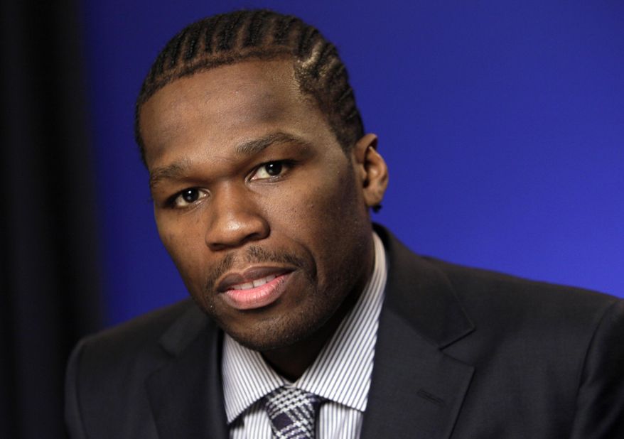 FILE - In this Oct. 26, 2011 file photo, Rapper and businessman Curtis Jackson III, known as 50 Cent, poses during an interview in New York. The rapper will have branding for his SMS Audio line on both of Swan Racing's NASCAR race cars. The logos will also be on the uniforms for Parker Kligerman and Cole Whitt, and the drivers will be featured on Swan-branded SMS Audio headphones. (AP Photo/Richard Drew, File)