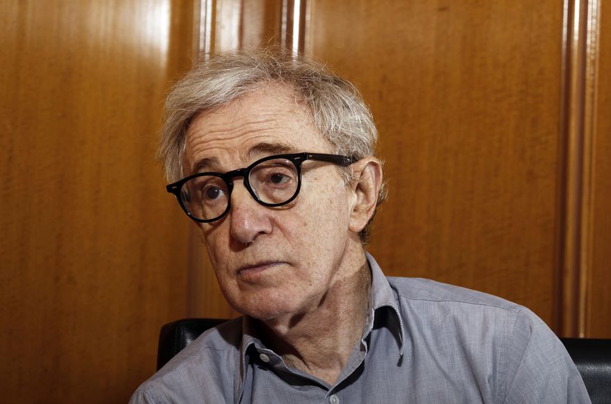 FILE - In this Dec. 29, 2011 file photo, Woody Allen, director of the film, "Midnight in Paris," is photographed during an interview in Beverly Hills, Calif. Dylan Farrow, the adopted daughter of Allen and Mia Farrow, penned an emotional open letter, accusing Hollywood of callously lionizing Allen, who she claims abused her. The letter revived in stunning detail an allegation more than two decades old. (AP Photo/Matt Sayles, File)