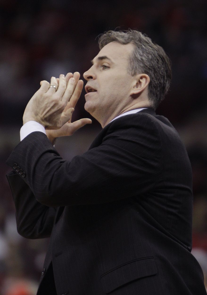 American University's head coach Mike Brennan instructs his team against Ohio State during the first half of an NCAA college basketball game on Wednesday, Nov. 20, 2013, in Columbus, Ohio. (AP Photo/Jay LaPrete) **FILE**