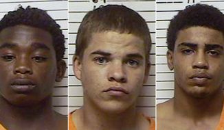 FILE - This combination file photo made with booking photos provided by the Stephens County, Okla., Sheriffs Department, shows, from left, James Francis  Edwards Jr., 15, Michael Dewayne  Jones, 17, and Chancey Allen Luna, 16, all of Duncan, Okla. The three teenagers have been charged in connection with the killing of 22-year-old Australian collegiate baseball player Christopher Lane, 22. The three teen are due in court on Tuesday, Feb. 4, 2014. (AP Photo/Stephens County Sheriffs Department, File)