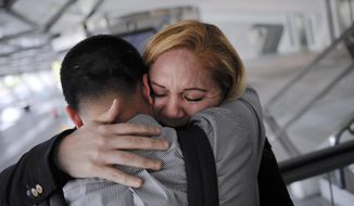 ADVANCE FOR USE SATURDAY, FEB. 8, 2014 AND THEREAFTER - In this Wednesday, Dec. 25, 2013 photo, Melba Soza embraces her son Jose Antonio as he arrives at the Bilbao airport in Bilbao, Spain from the United States for a five-day visit. For the past three years, Jose has been on a mission: To bring his mother back to the U.S. His work has taken him to Congress, gotten him meetings with the likes of Donald Trump and Mark Zuckerberg, landed him on television. Along the way, he has grown into a steady force in the national immigration debate, a young but powerful voice for his family and the many others hoping to one day reunite. (AP Photo/Alvaro Barrientos)