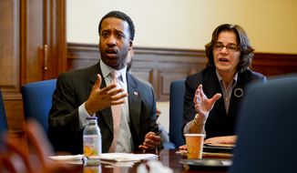 Councilmembers Kenyan McDuffie (D- Ward 5), left, and Mary Cheh (D-Ward 3), right, speak during a breakfast meeting before a Committee of the Whole Meeting at the Wilson Building, Washington, D.C., Tuesday, February 4, 2014. (Andrew Harnik/The Washington Times) **FILE**