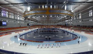 Speedskaters from various countries train at the Adler Arena Skating Center during the 2014 Winter Olympics in Sochi, Russia, Wednesday, Feb. 5, 2014. (AP Photo/Matt Dunham)