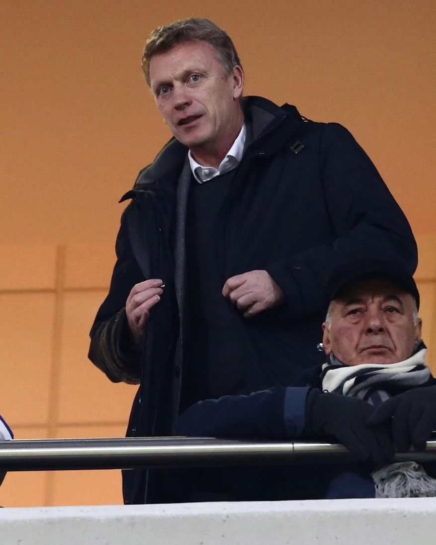 Manchester United manager David Moyes watches a Greek league soccer match at Karaiskaki Stadium, in port of Piraeus, near Athens, on Wednesday, Feb. 5, 2014. The Scottish coach traveled to Greece to watch Olympiakos before his team faces the Greek side in the Champions League on Feb. 25 and March 19. The defending Greek champion ended its 23rd league game undefeated Wednesday, beating Panionios 2-0. (AP Photo/InTime Sports, Yorgos Matthaios)