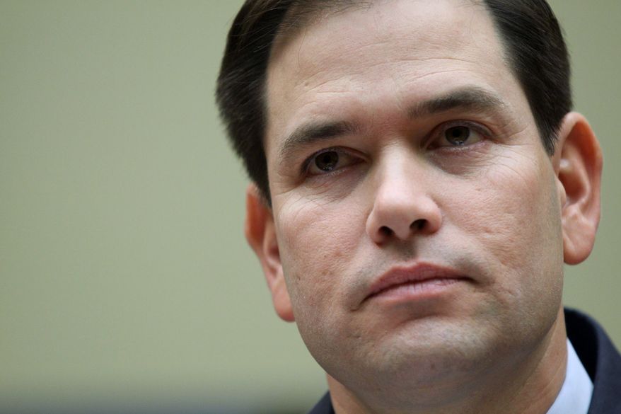 **FILE** Sen. Marco Rubio, Florida Republican, listens while testifying on Capitol Hill on Feb. 5, 2014, before the House Committee on Oversight and Government Reform hearing on Obamacare.  (Associated Press)