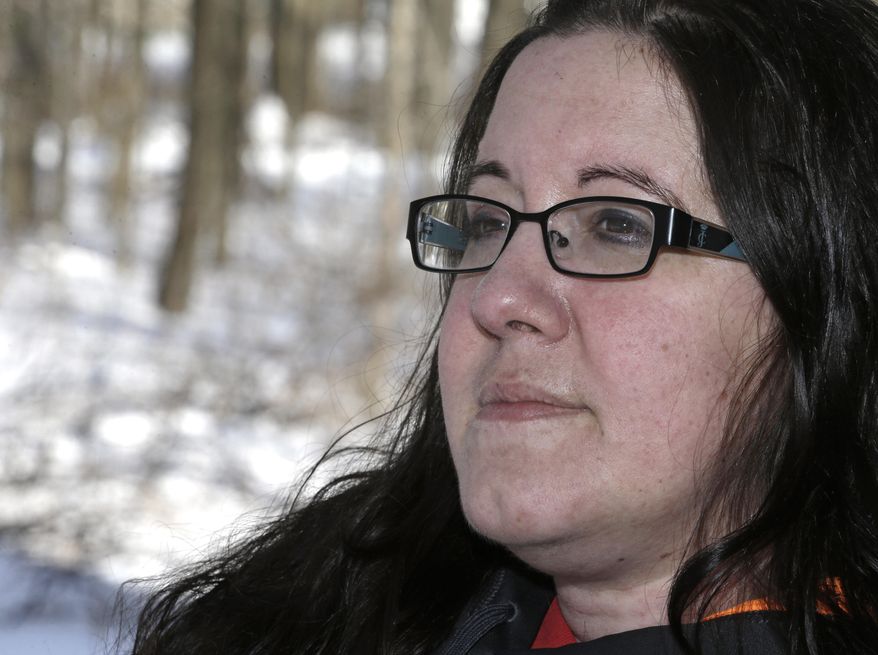 Denise Miller poses on her front porch Thursday, Feb. 6, 2014, in Southington, Ohio. Miller suffered a stroke last year that fooled doctors at two Northeast Ohio hospitals before it was finally diagnosed at the Cleveland Clinic. She was 36 and had no traditional risk factors. Each year, nearly 800,000 Americans have a new or recurrent stroke, which occurs when a blood vessel to the brain is blocked by a clot or bursts. Stroke is the fifth-leading cause of death for men and the third-leading cause for women. (AP Photo/Tony Dejak)