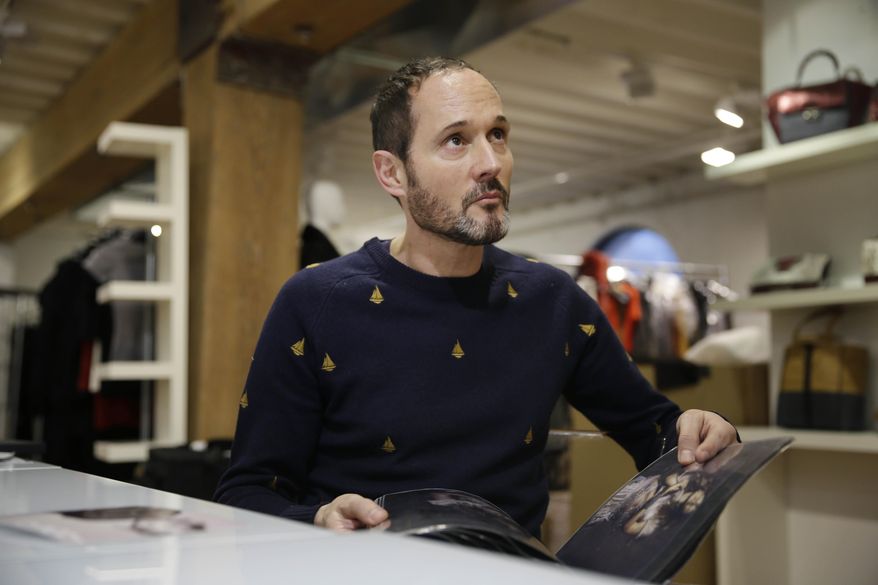 In this Monday, Feb. 3, 2014 photo, Josep Font, creative director of DelPozo, looks over a model during a model casting in New York. (AP Photo/Seth Wenig)