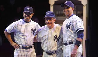 This image released by Polk &amp;amp; Co. shows Peter Scolari, portraying baseball legend Yogi Berra, center, and Francois Battiste, left, and Christopher Jackson in a scene from the play, &amp;quot;Bronx Bombers,&amp;quot; which examines the rich history of the New York Yankees. (AP Photo/Polk &amp;amp; Co., Joan Marcus)