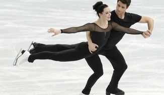 Scott and Tessa Moir of Canada practice during a the Ice Dance training session at the Iceberg Skating Palace ahead of the 2014 Winter Olympics, Wednesday, Feb. 5, 2014, in Sochi, Russia. (AP Photo/Bernat Armangue)