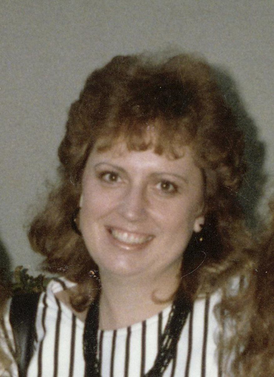 This undated photo provided by the Santa Clara County District Attorney shows Cathy Zimmer, who was strangled 25 years ago. Authorities in Silicon Valley are trying to identify the maker or owner of the quilt that was found on Zimmers' body. The Santa Clara County District's Attorney's Office released a photo of the quilt on Thursday, Feb. 6, 2014. They hope someone will recognize it and come forward with information that will lead to whoever killed 38-year-old Cathy Zimmer. (AP Photo/Santa Clara County District Attorney)