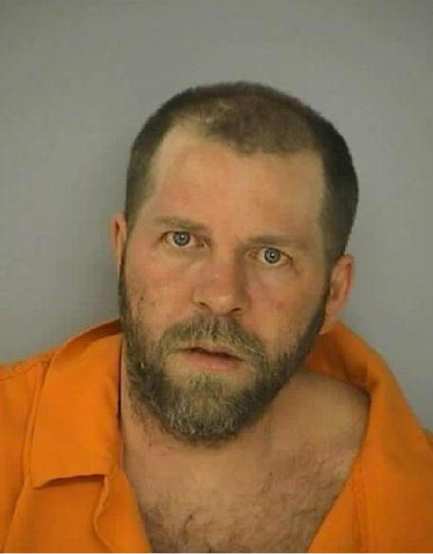 This handout photo provided by the Washington County, Md., Sheriff’s Office shows Thomas Hungerford Jr. in a mug shot dated Sept. 20, 2011. Hungerford was charged Friday in the fatal stabbing Thursday of Tylena Sigler and the wounding of a male victim at the same address.  (AP Photo/Washington County, Md., Sheriff’s Office)