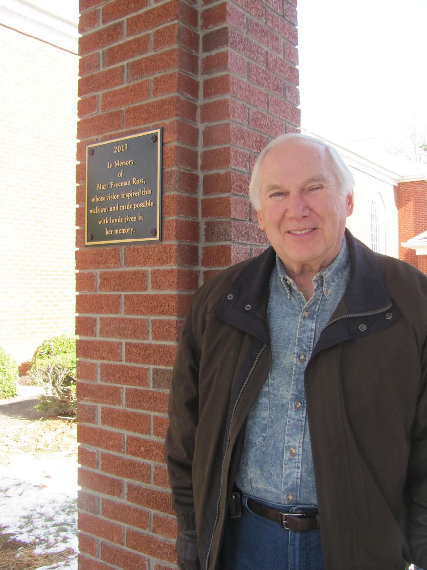 ADVANCE FOR MONDAY, FEB. 10, AND THEREAFTER - In a Jan. 30, 2014 photo, Jim Freeman stands outside the bell tower at the MT. Vernon Baptist Church, in Mt. Vernon, N.C., where the 1898 church bell was dedicated recently after its return to the church after more than 50 years. (AP Photo/The Daily Courier, Jean Gordon)
