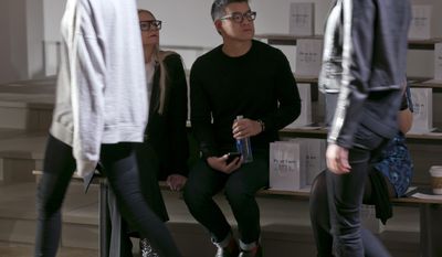 Designer Peter Som watches the rehearsal before his Fall 2014 collection is modeled during Fashion Week in New York,  Friday, Feb. 7, 2014. (AP Photo/Richard Drew)