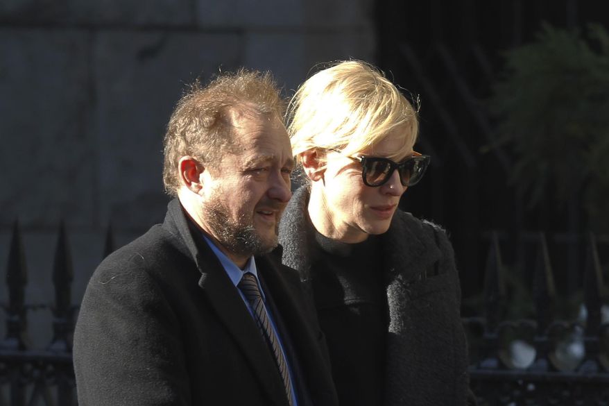 Actress Cate Blanchett and her husband Andrew Upton arrive at the the Church of St. Ignatius Loyola for the private funeral of actor Philip Seymour Hoffman Friday, Feb. 7, 2014, in New York. Hoffman, 46, was found dead Sunday in his Greenwich Village apartment. (AP Photo/Jason DeCrow)