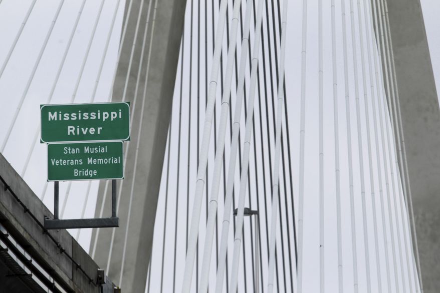 In this Feb. 5, 2014 photo, the Stan Musial Veterans Memorial Bridge crossing the Mississippi River from Missouri to Illinois is seen from St. Louis. The new four-lane, cable-stayed bridge named after St. Louis Cardinals great Stan Musial, a $700 million project that took a few years, and a few squabbles, to complete, is scheduled to open to motorists on Sunday, Feb. 9, 2014. (AP Photo/Belleville News-Democrat, Derik Holtmann)