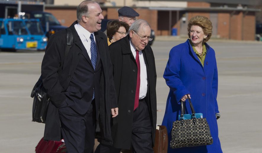 From left, Rep. Dan  Kildee D-Mich., Sen. Carl Levin  D-Mich., and Senate Agriculture Committee Chair Sen. Debbie Stabenow D-Mich., walk toward Air Force One before President Barack Obama&#39;s arrival, Friday, Feb. 7, 2014, at Andrews Air Force Base, Md. The group traveled with the president to East Lansing, Mich. where the president was to sign the farm bill at Michigan State University. ( AP Photo/Jose Luis Magana)
