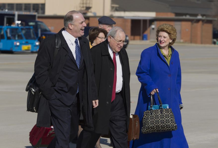 From left, Rep. Dan  Kildee D-Mich., Sen. Carl Levin  D-Mich., and Senate Agriculture Committee Chair Sen. Debbie Stabenow D-Mich., walk toward Air Force One before President Barack Obama&#39;s arrival, Friday, Feb. 7, 2014, at Andrews Air Force Base, Md. The group traveled with the president to East Lansing, Mich. where the president was to sign the farm bill at Michigan State University. ( AP Photo/Jose Luis Magana)