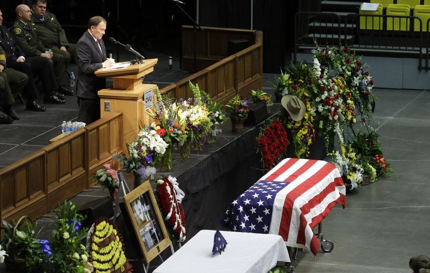 Utah Gov. Gary Herbert speaks during the funeral for Utah County Sheriff's Sgt. Cory Wride at Utah Valley University Wednesday, Feb. 5, 2014, in Orem, Utah. Wride was killed on Jan. 30 on a rural highway about 35 miles south of Salt Lake City. Wride had stopped to check on a truck with its emergency lights on when he was shot twice while seated in his patrol car. (AP Photo/Rick Bowmer)