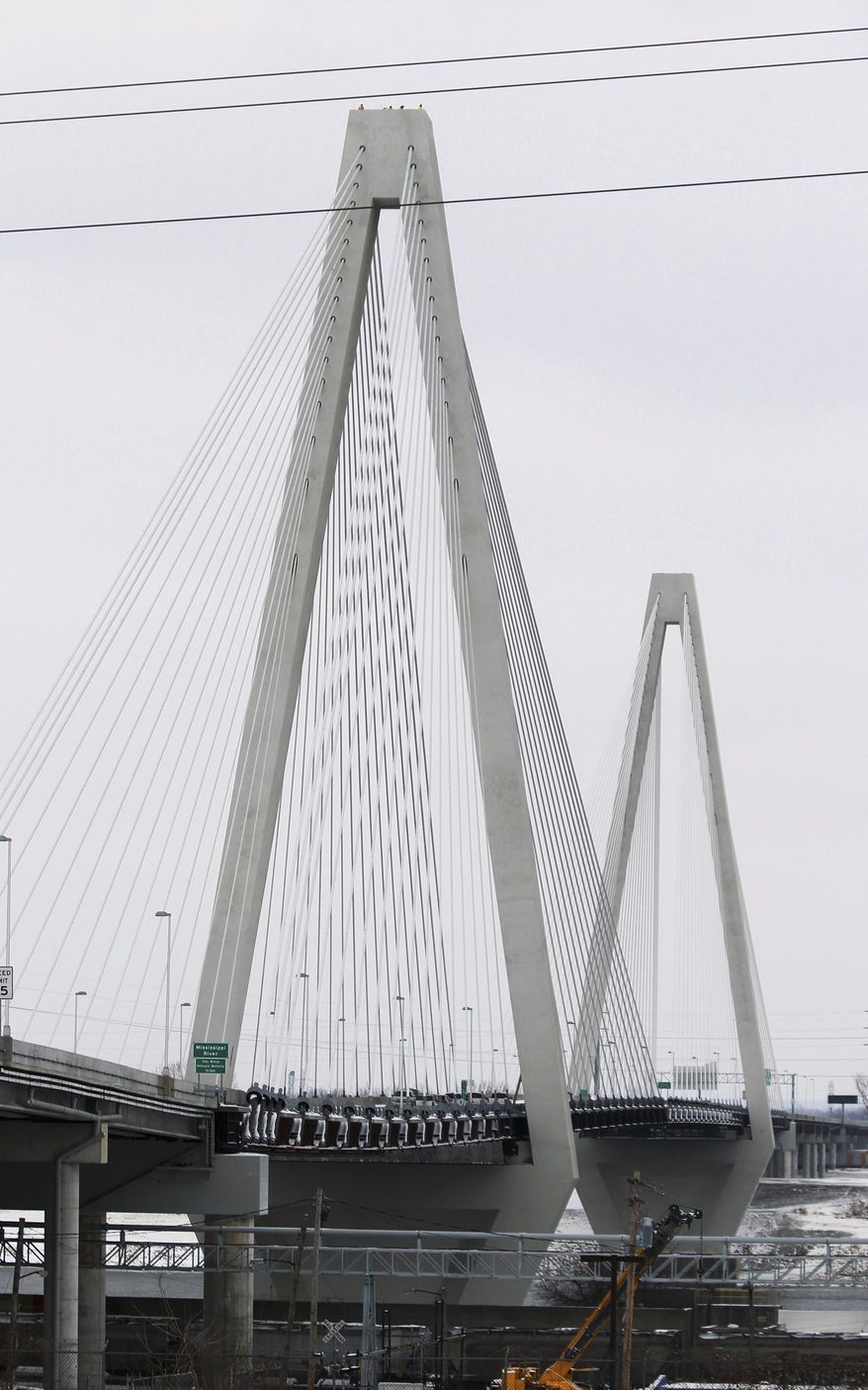In this Feb. 5, 2014 photo, the Stan Musial Veterans Memorial Bridge crossing the Mississippi River from Missouri to Illinois is seen from St. Louis. The new four-lane, cable-stayed bridge named after St. Louis Cardinals great Stan Musial, a $700 million project that took a few years, and a few squabbles, to complete, is scheduled to open to motorists on Sunday, Feb. 9, 2014. (AP Photo/Belleville News-Democrat, Derik Holtmann)