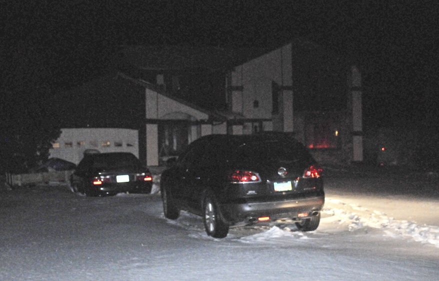 Vehicles are parked in the driveway of a home south of Defiance, Ohio on Thursday night, Feb. 6, 2014, after an apparent murder-suicide left four people dead. Officials identified the dead as Robert Garza Sr., 68, his wife, Christine Garza, 61, their daughter, Zoila Garza, 42, and a granddaughter, 15-year-old Rebecca Garza. The grandfather apparently killed the others and then took his own life, according to Defiance County sheriff's department investigators. (AP Photo/The Crescent-News, Jeff Long)