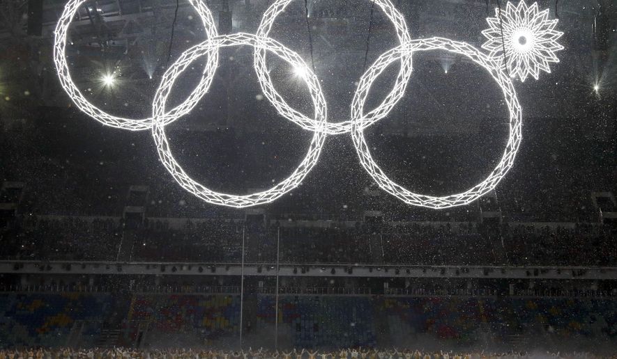 One of the rings forming the Olympic Rings fails to open during the opening ceremony of the 2014 Winter Olympics in Sochi, Russia, Friday, Feb. 7, 2014. (AP Photo/Mark Humphrey)